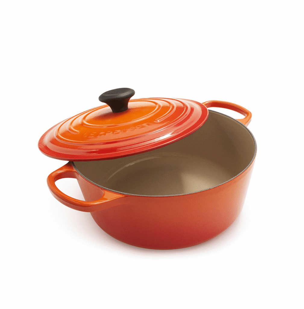 Le Creuset Enameled Cast Iron Signature Round Dutch Oven in the color flame against a white background