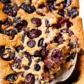 Delicious cherry cobbler with spoon.