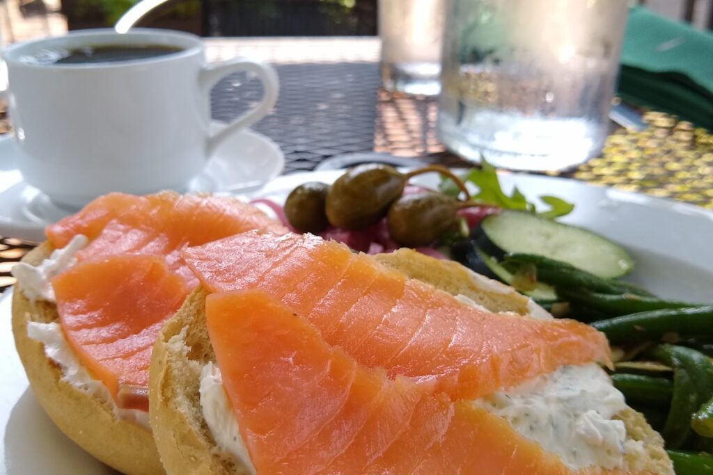 A bagel topped with cream cheese and lox.
