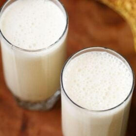 Korean banana milk in two glasses with text layovers.